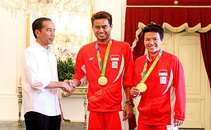 Tontowi Ahmad dan Liliyana Natsir bersama Presiden Joko Widodo